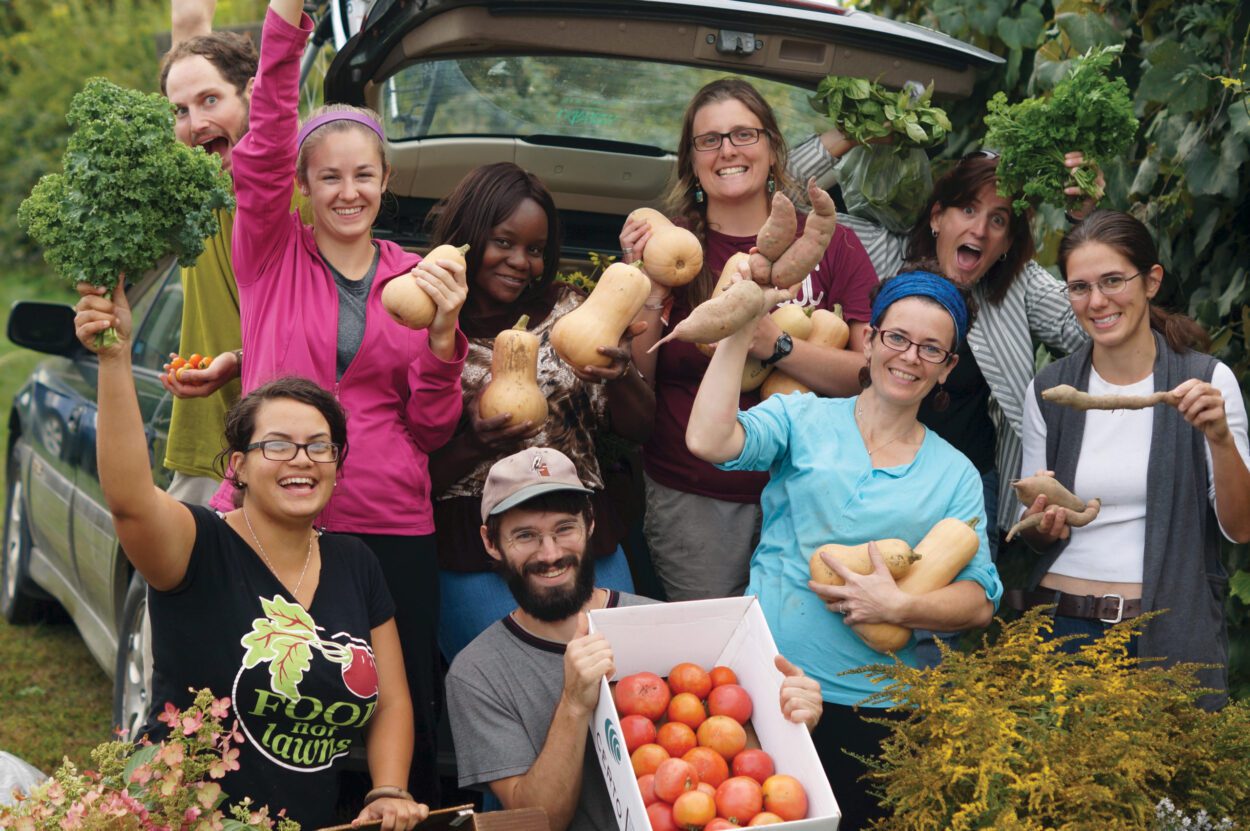 Keene's Community Garden Connections members displaying their harvest.