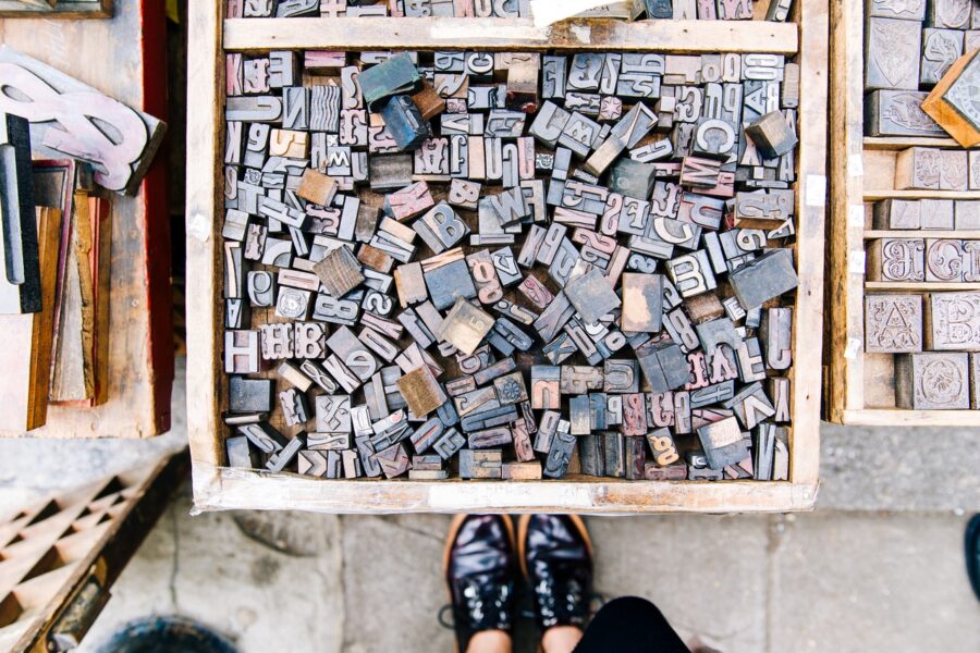 Stamping letters scattered in a box
