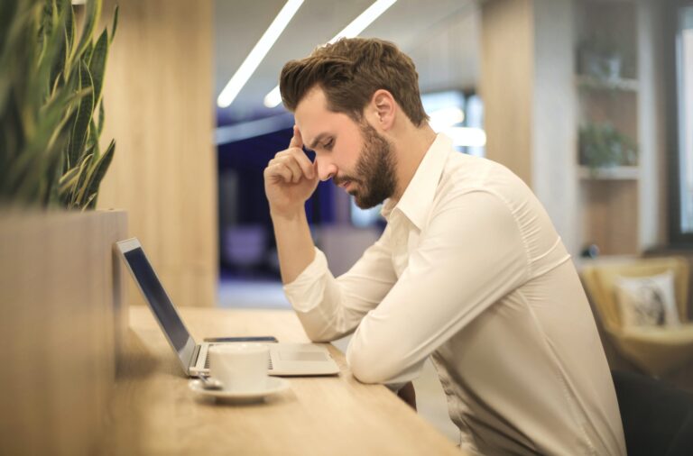 Frustrated individual at computer