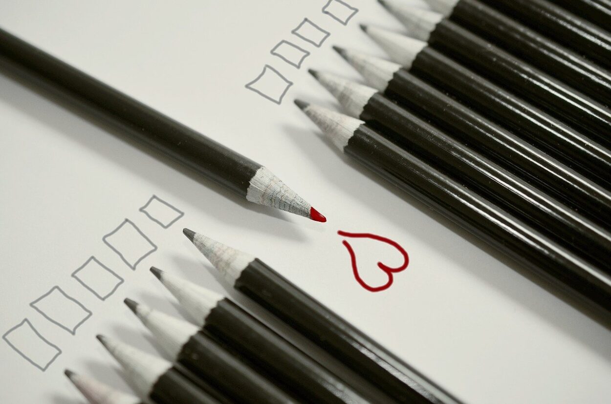 pencils with one red heart