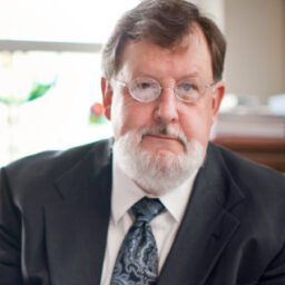 Stephen Southern wearing a gray suit and tie.