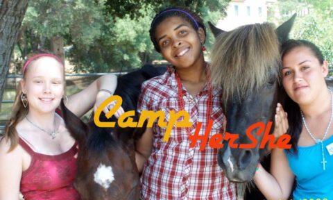 Three girls and two horses smile, posing for a photo, with the words Camp HerShe superimposed.