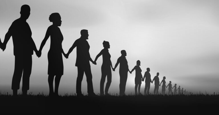 Black and white image of people holding hands