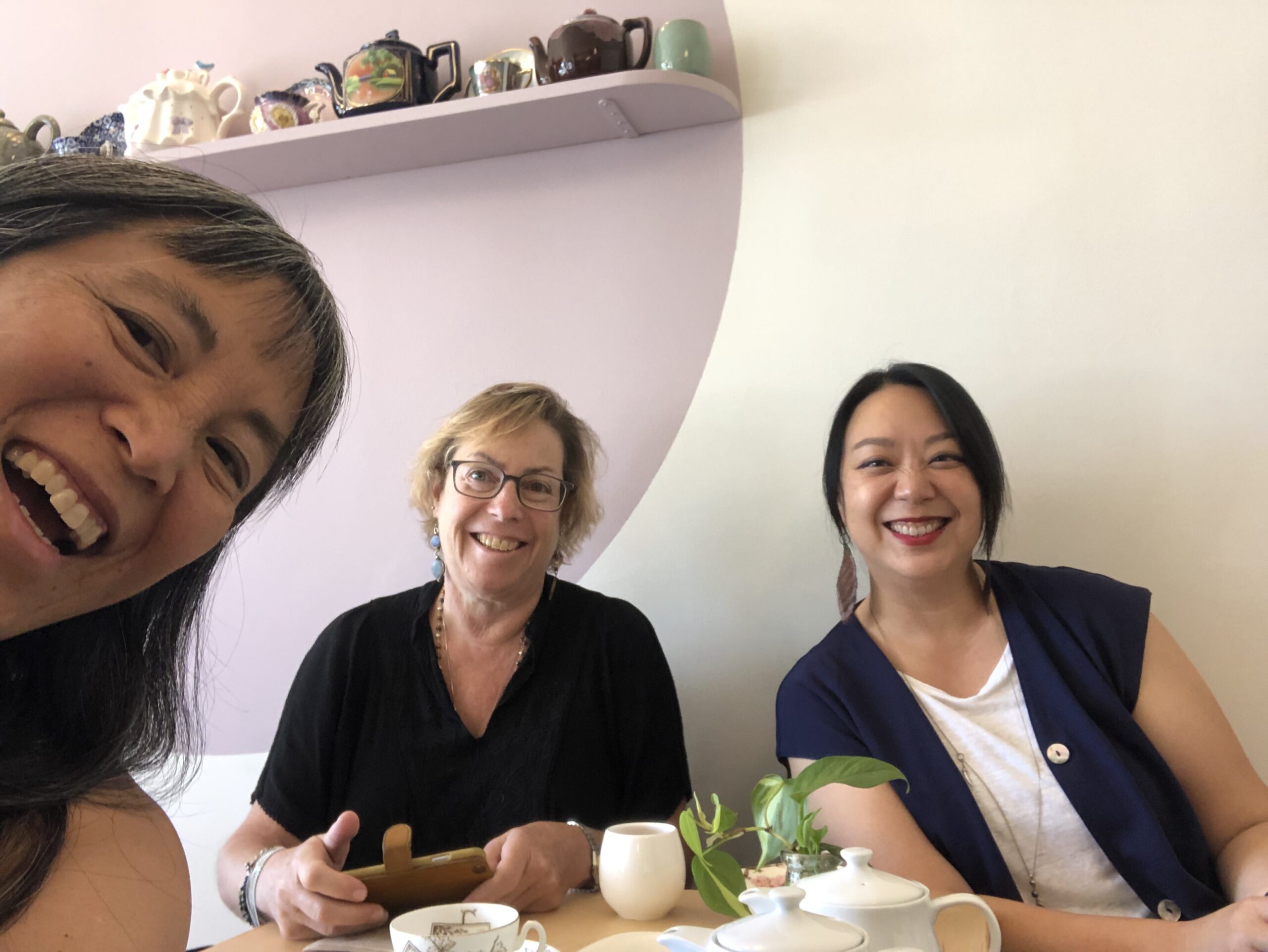 Antioch Dean of Undergraduate Studies MeHee Hyun (left) and Undergraduate faculty Jane Paul (center) were in the (tea) house with alum and Callisto Tea House owner Wendy Chen (right).