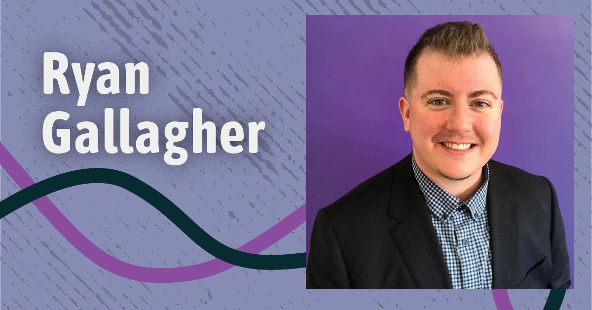 Ryan Gallagher smiling on light purple background