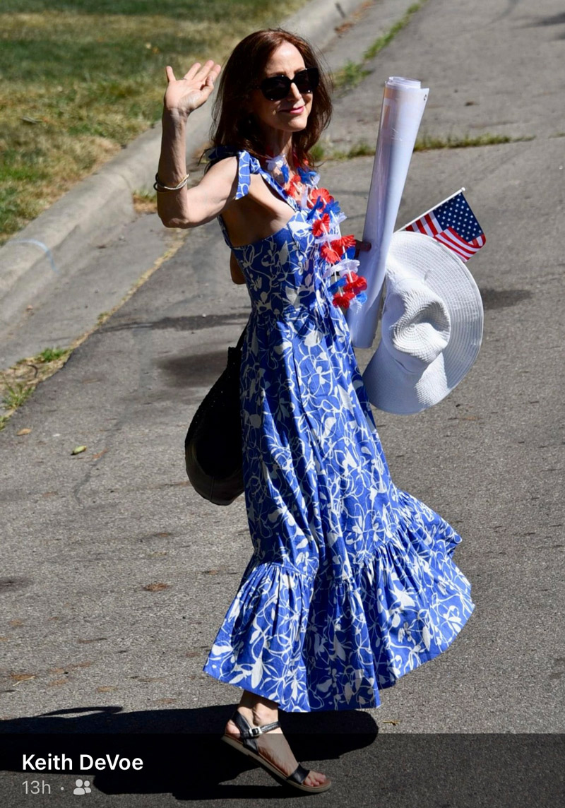 Author in blue dress after a parade.