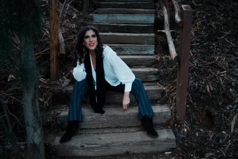 Arielle Silver sitting on wooden steps