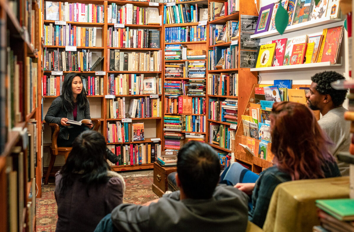A author hosting a reading from their book in a bookstore to highlight why you should study literature and creative writing