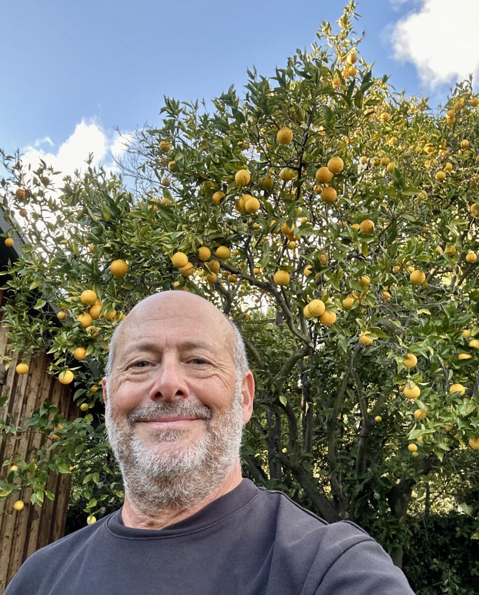 Mark Gozonsky standing in front of a lemon tree