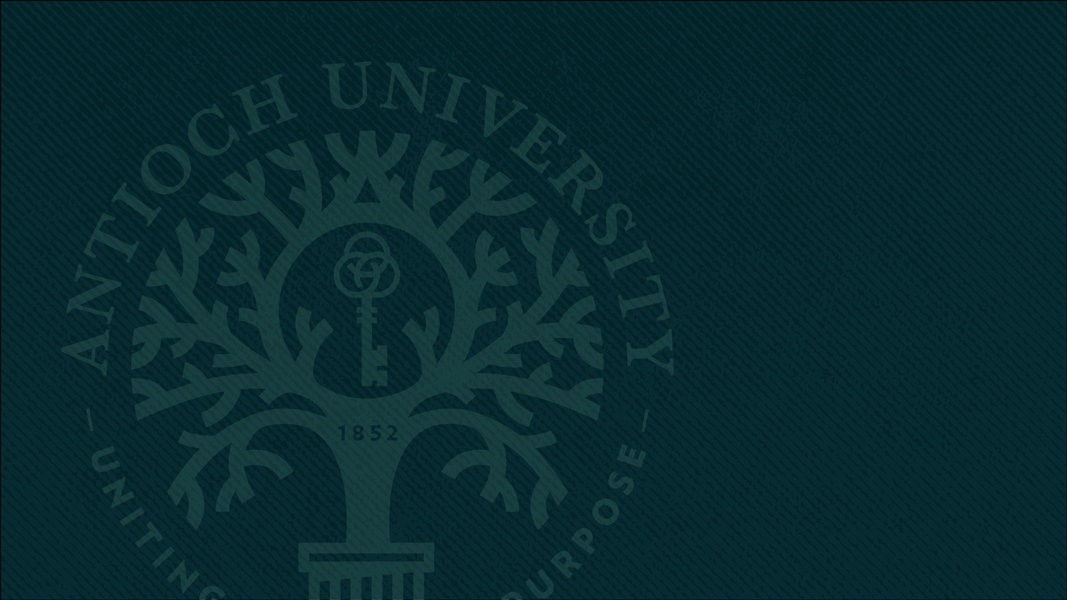 Dark green Antioch University seal with tree and key at center.