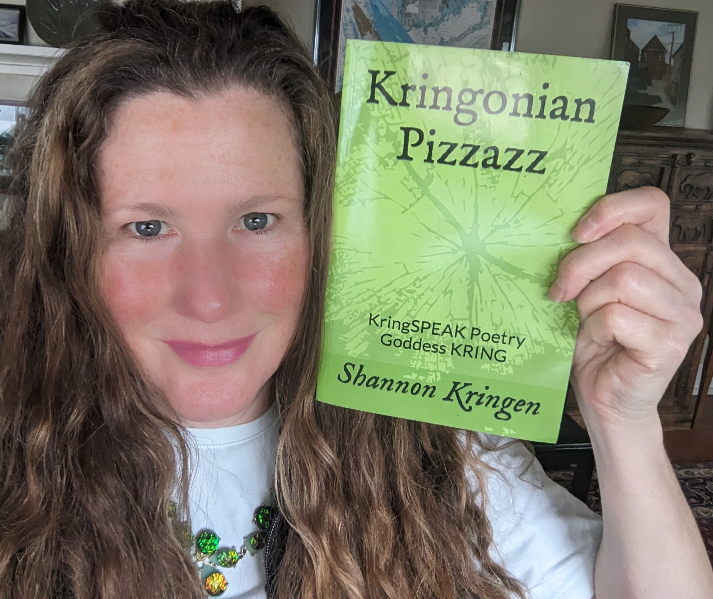 Shannon Kringen holding her book Kringonian Pizzazz Book Jacket KringSpeak Goddess Kring by Shannon Kringen