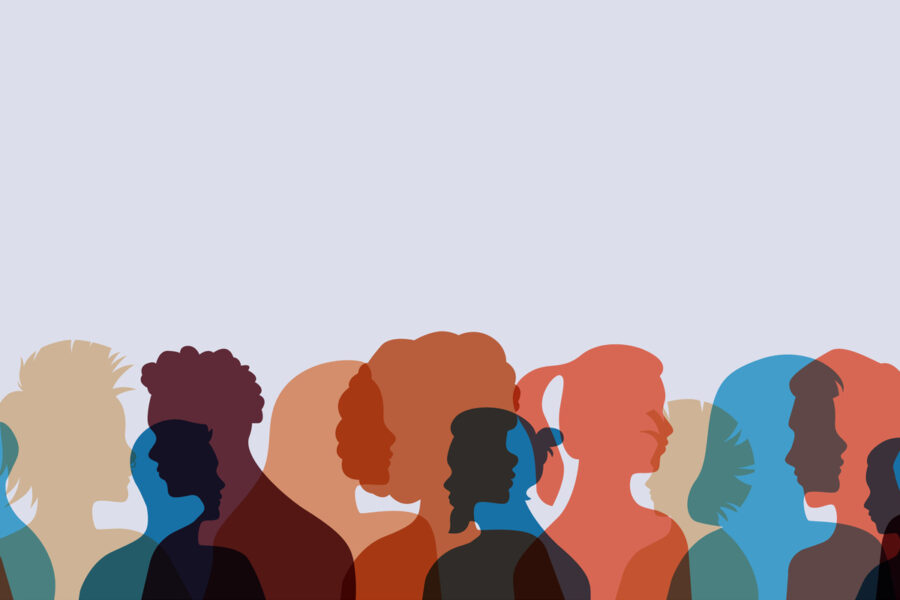 A silhouette of a diverse group of individuals standing against a backdrop.