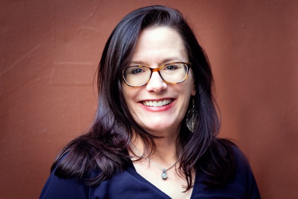 Kate Maruyama smiling and wearing glasses