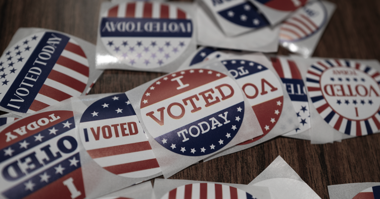 An image of various I Voted Today round stickers in red white and blue.