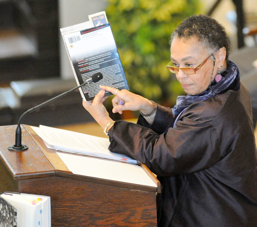 Image of Judy richardson speaking at a podium