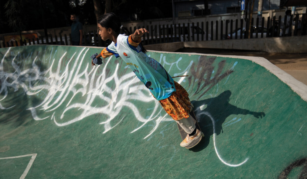 A Bangladeshi girl on a skateboard.