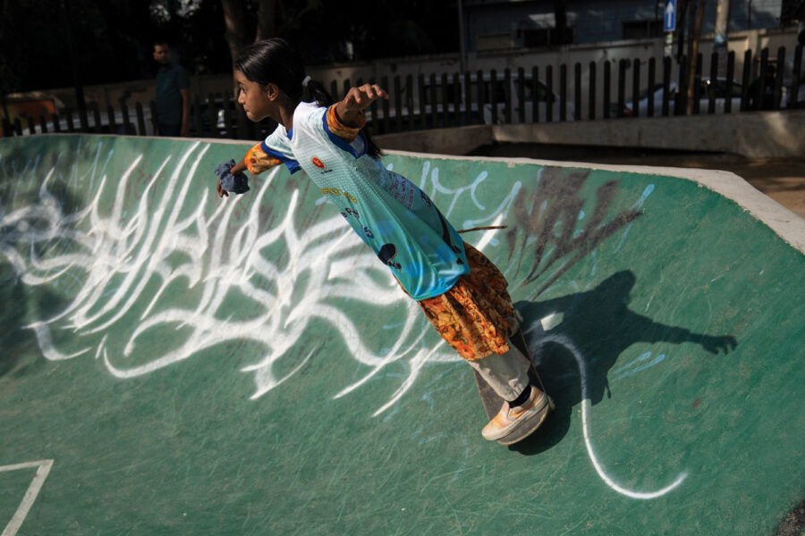 A Bangladeshi girl on a skateboard.