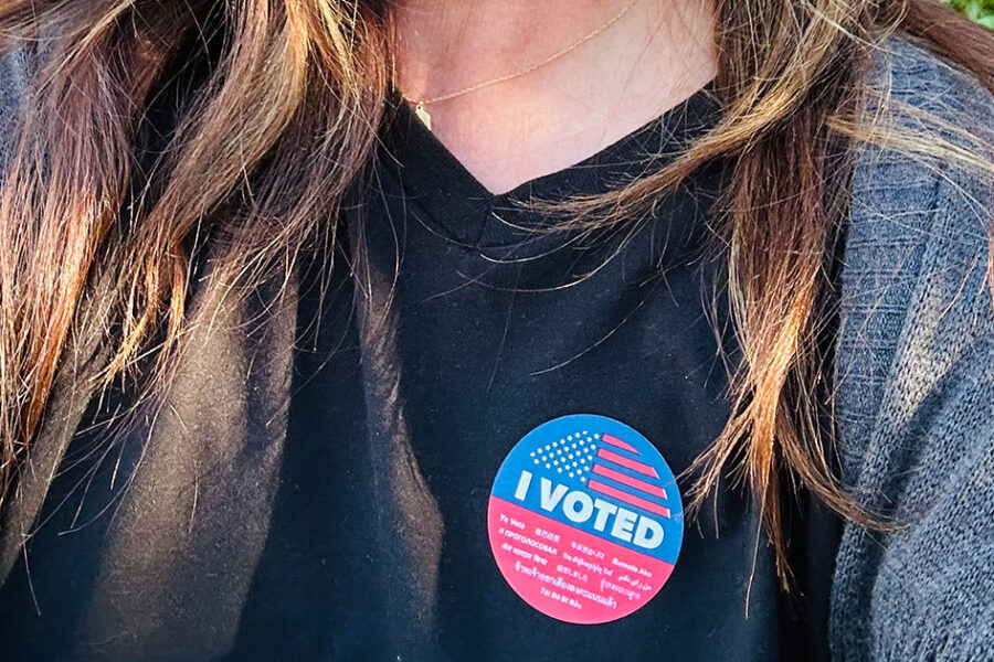 Andrea Tate with I voted sticker on her shirt.