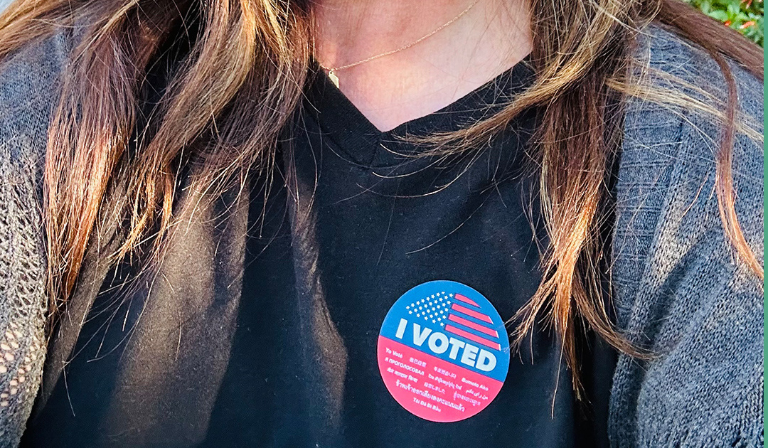 Andrea Tate with I voted sticker on her shirt.