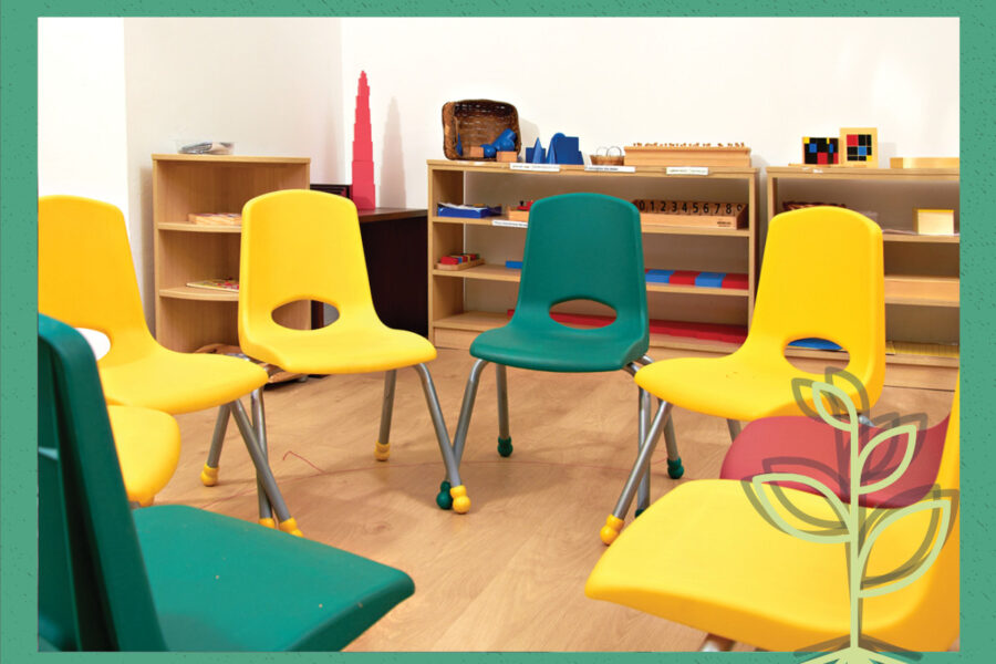 A classroom featuring several chairs arranged around a central table, designed for group learning and discussions.