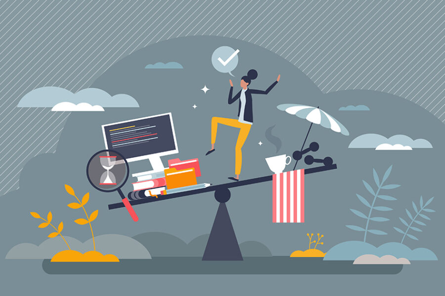 A person sits on a balance beam, working on a laptop surrounded by various items.