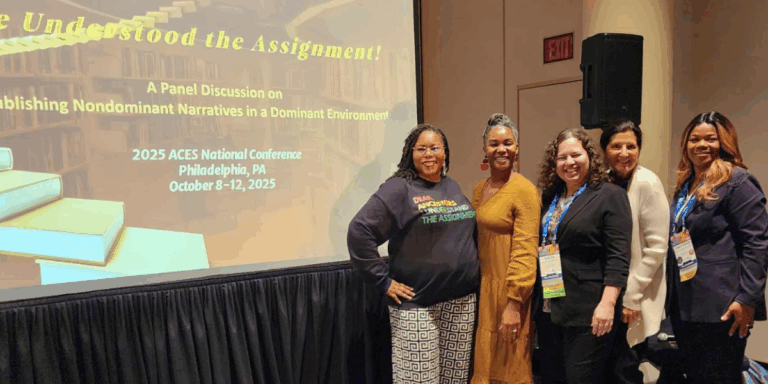 Group of panelists pose in front of a screen reading ‘We Understood the Assignment!—Publishing Nondominant Narratives in a Dominant Environment, 2025 ACES National Conference, Philadelphia, Oct 8–12, 2025.
