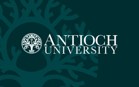Antioch University logo in white with the university seal on a teal background featuring a large stylized tree graphic.