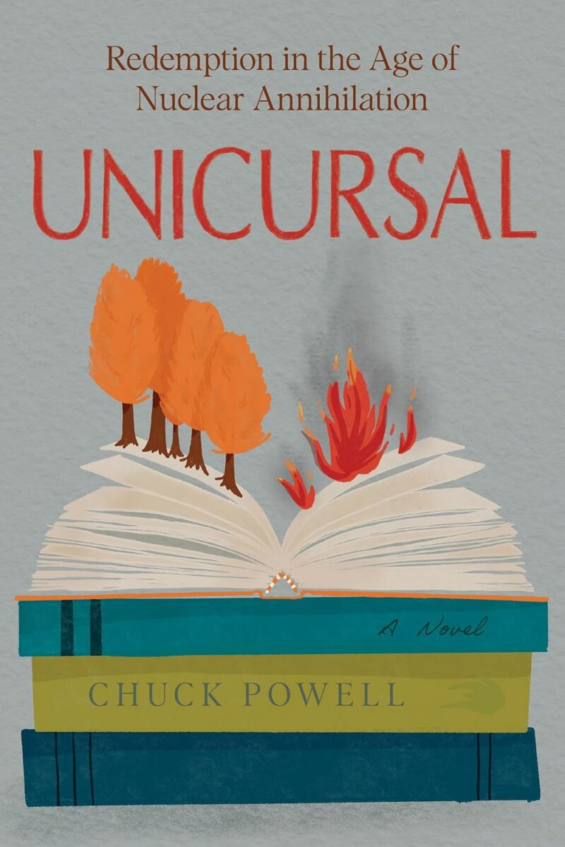 Book cover for Unicursal: Redemption in the Age of Nuclear Annihilation by Chuck Powell. The illustration shows an open book resting on a stack of books, with orange trees growing from one page and red flames rising from the other, against a textured pale gray background.
