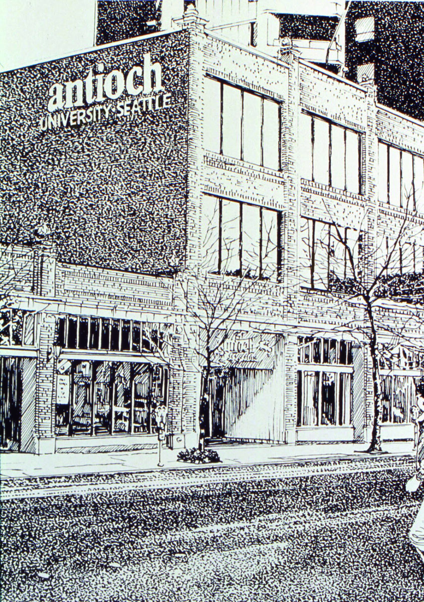 Exterior view of Antioch University Seattle building on a tree-lined urban street, with a large sign reading 'antioch UNIVERSITY SEATTLE' on the facade.